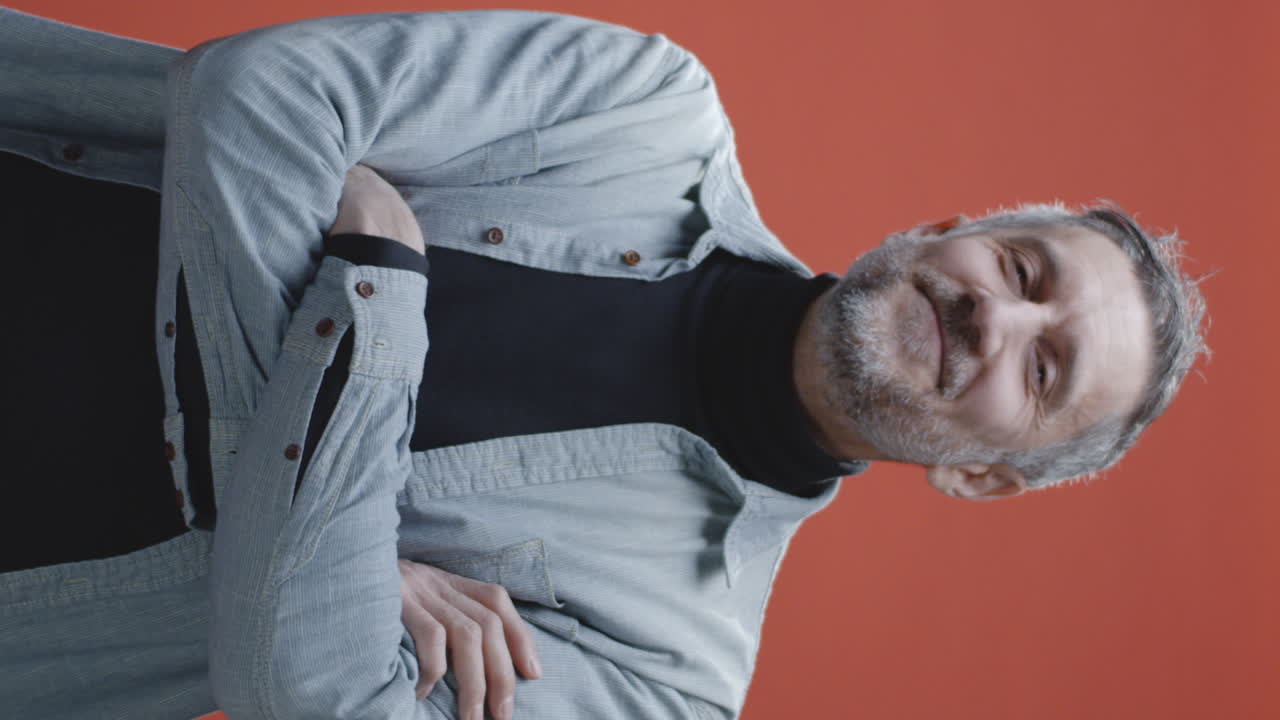 Portrait of a Smiling Man with Arms Crossed