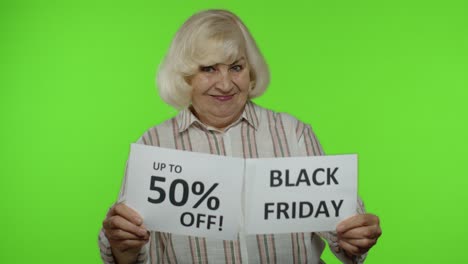 grandmother showing black friday and up to 50 percent off shopping price discount advertisement