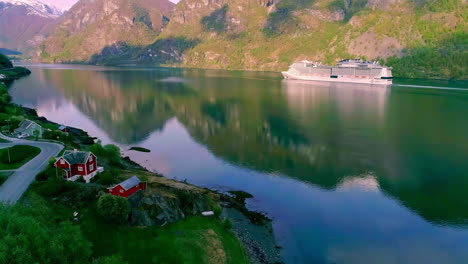 a cruise ship sailing on a fjord in norway - aerial view