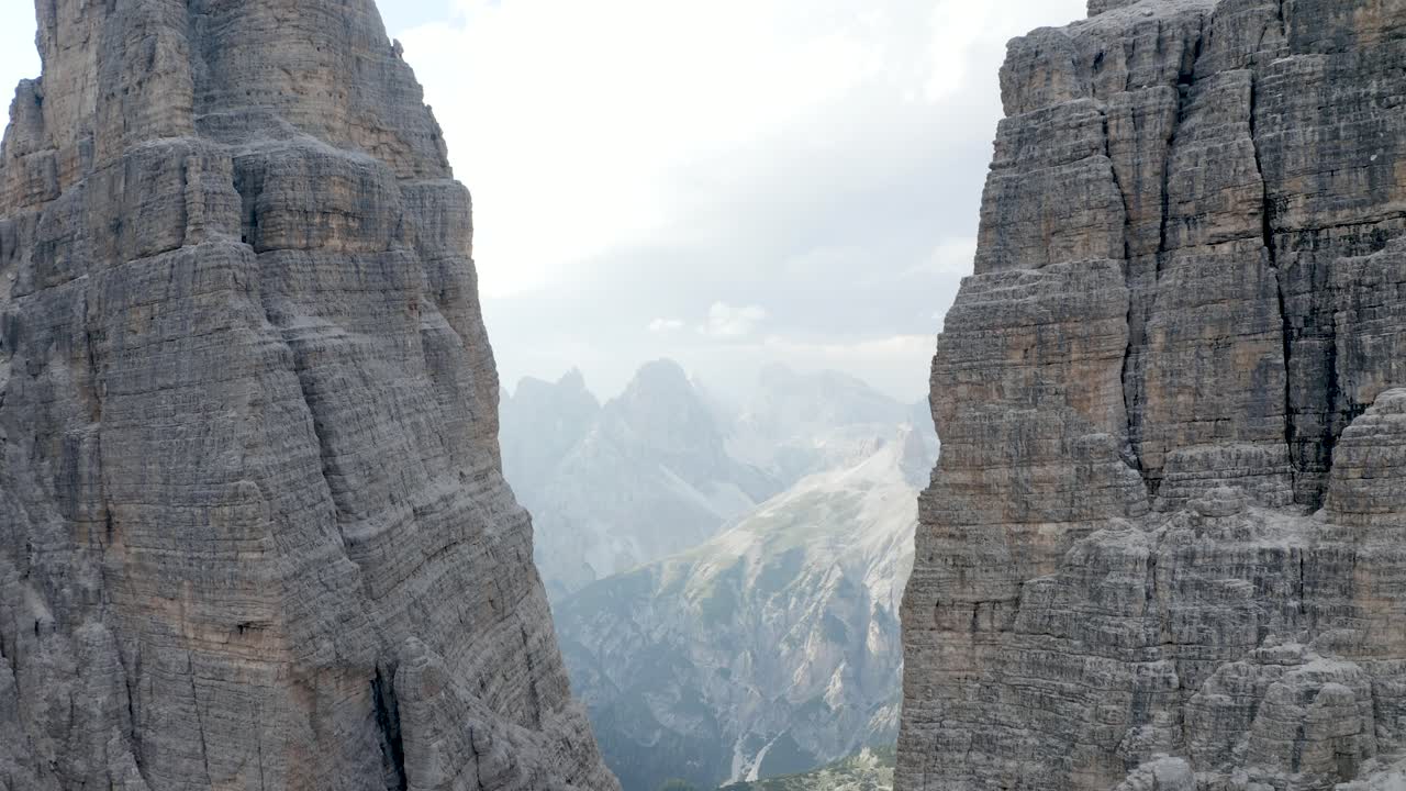 Flying in between two mountain tops in the peaks of the Italian Dolomites