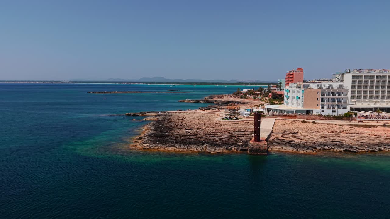 Coastal view with buildings and rocky shoreline
