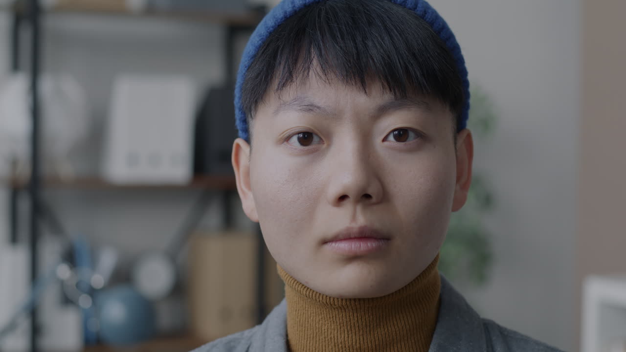 Close-up portrait of a young Asian woman
