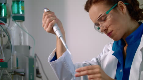 female chemist doing chemistry research. scientist working on chemical research