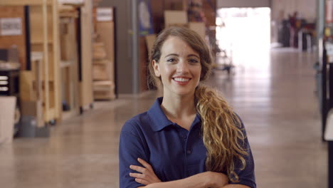 Female-Factory-Worker-Walks-Towards-Camera-In-Slow-Motion