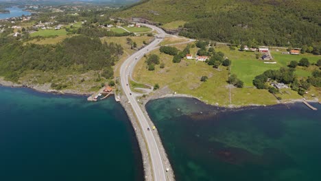 atlantic ocean road. bridge across fjord with clear blue and turquoise sea water at kristiansund, norway