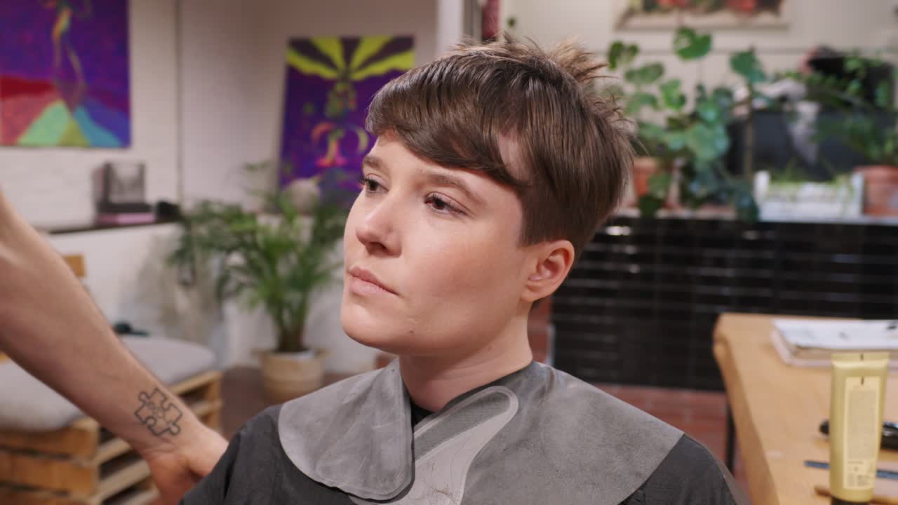 A person getting a haircut in a hair salon