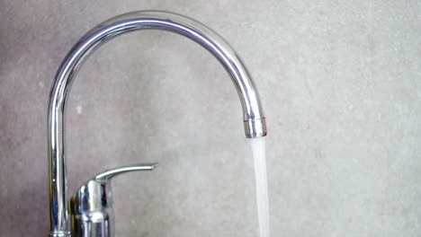 running water from a modern kitchen faucet