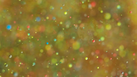 abstract chaotic motion of particles in space. slow motion bright colors bubbles oil paint universe moving multicolored close up. acrylic paint. fantastic hypnotic surface. big bang. nanotechnology.