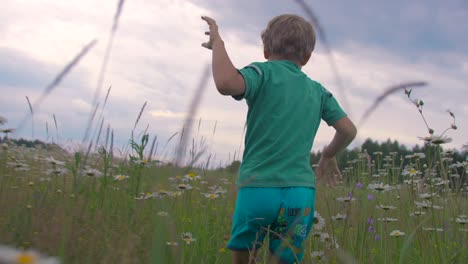 child running in a meadow