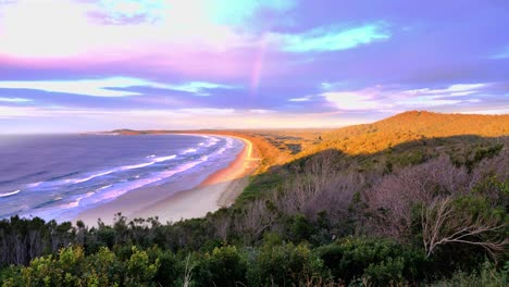 colorful sunrise over the beach and ocean - mountain view at crescent head - sydney, nsw, australia