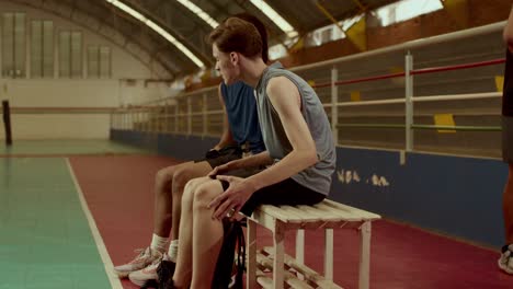Basketball Players Training and Resting in a Gymnasium