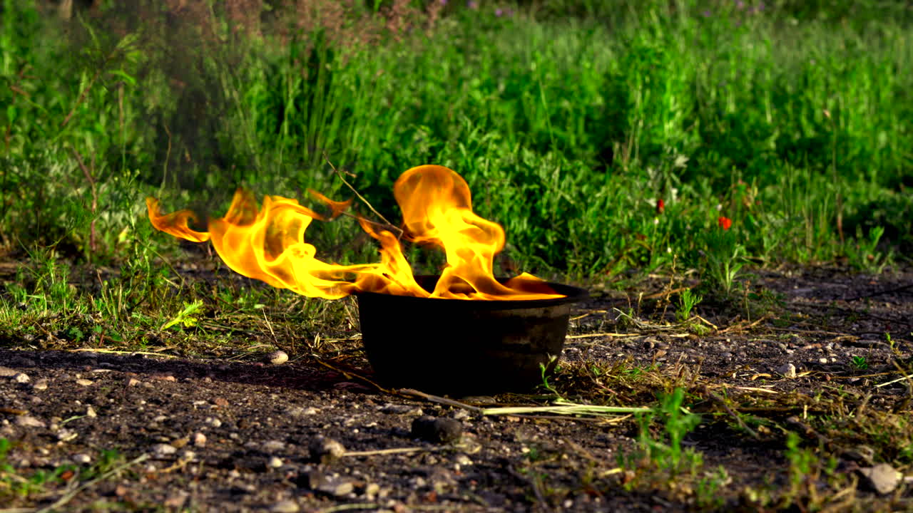 Fire burning in a pot outdoors