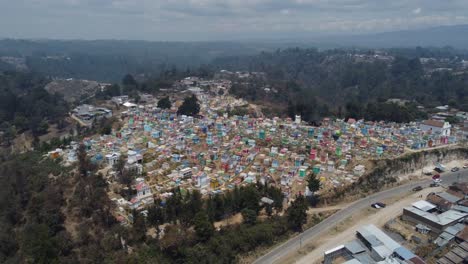 Aerial-orbits-bright,-colourful-crypt-buildings-in-Guatemala-cemetery