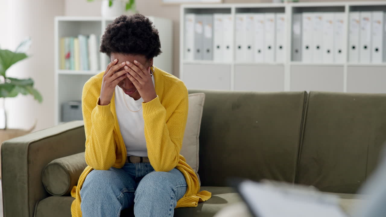 A woman experiencing sadness and depression during a therapy session