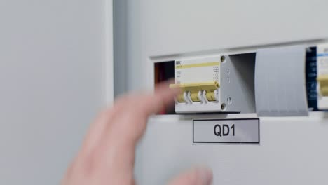 person working on electrical panel