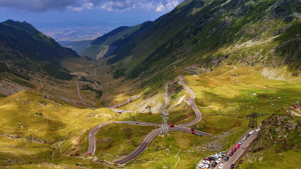 Rising over the picturesque valley with stunning road. Jaw-dropping scenery of Transfagarash highway in Romania