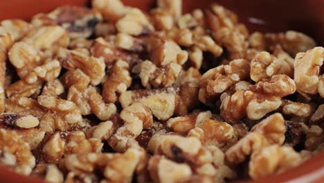 walnuts without shell close-up macro. man hand take a piece of walnut. peeled nuts. healthy snacks. product rich in minerals and vitamins.