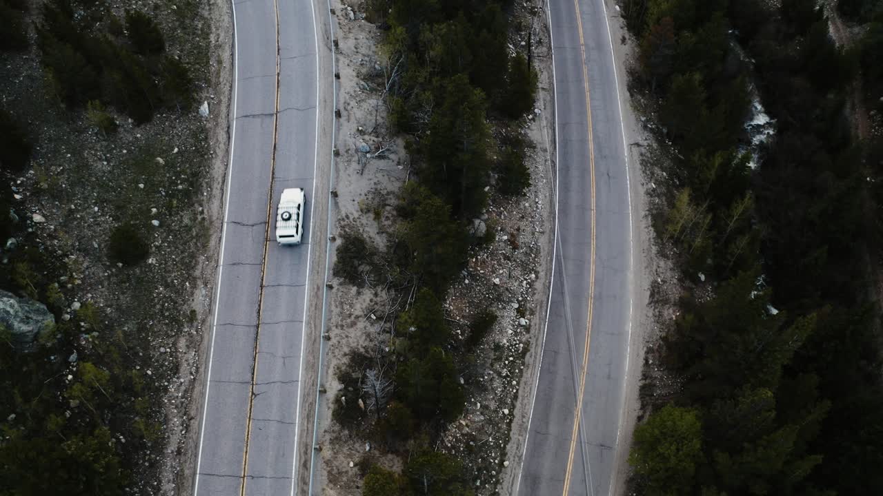 Overhead view of cars driving on worn down highways in Colorado's mountains