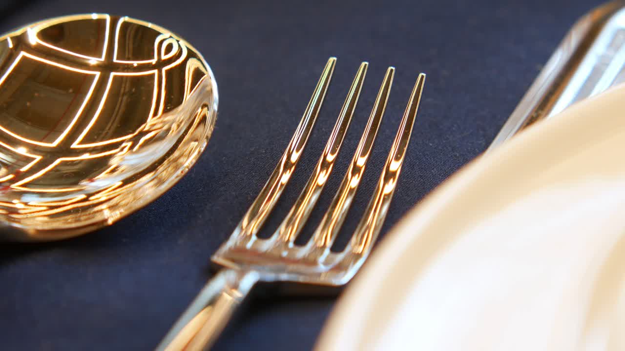Close-up of a fork and spoon on a table setting