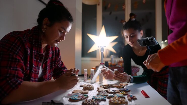 People Decorating Christmas Cookies
