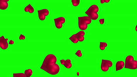 Pink-hearts-floating-against-green-screen