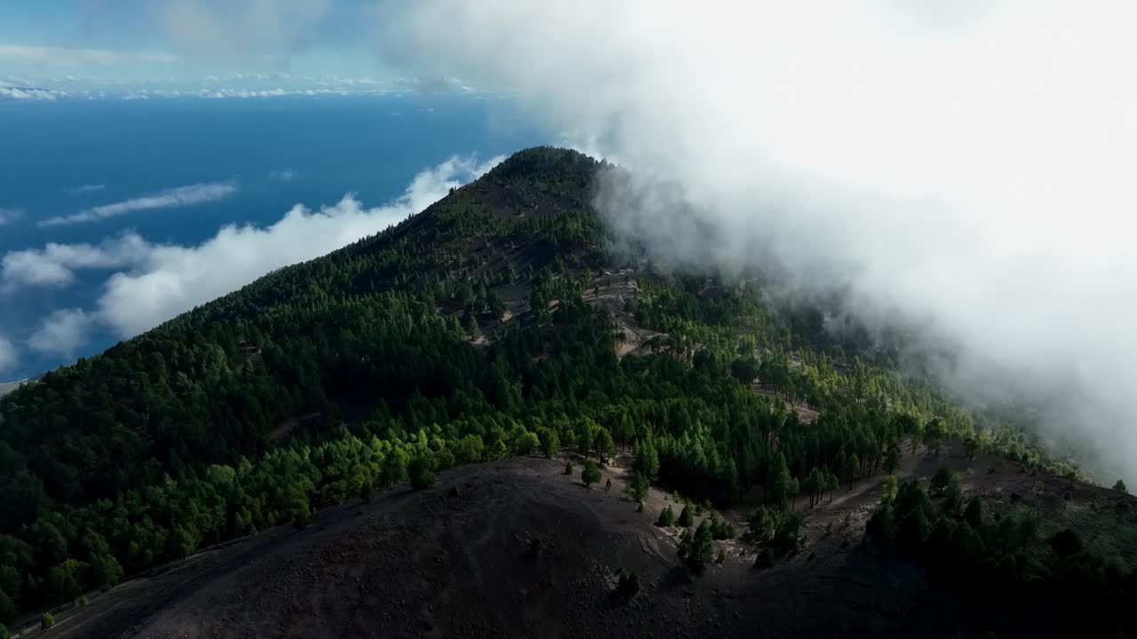 Majestic Mountain Peak Shrouded in Fog, Aerial View