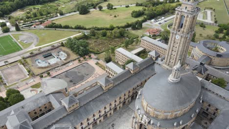 High-overhead-view-of-La-Laboral-in-Gijon-with-green-countryside-surrounding