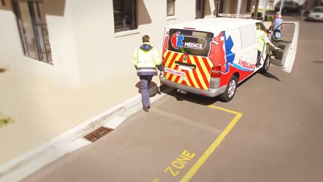 hospital staff getting into the ambulance