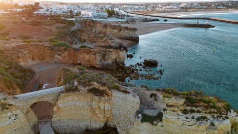 coastal cliffs overlook tranquil waters near lagos, portugal at sunset