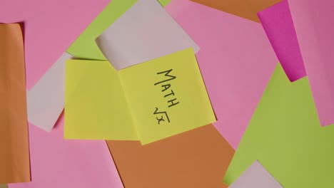 education concept of revolving sticky notes with math and equation written on top note