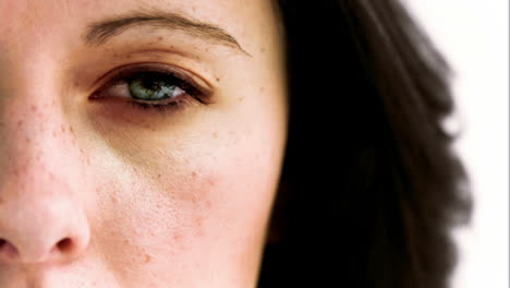 woman opening in slow motion her eye with a camera inside