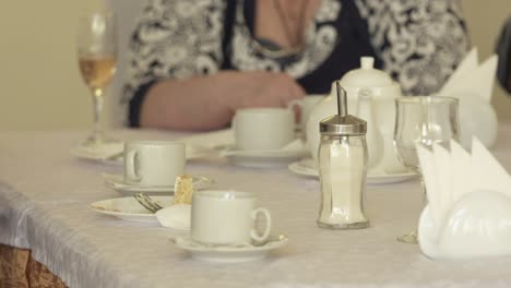 senior citizens at festive dinner eating cake