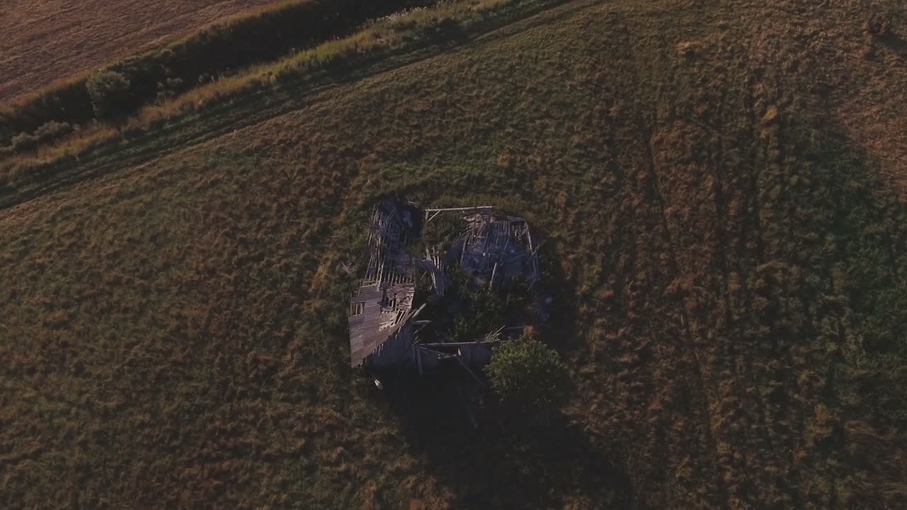 Collapsed Wooden Rural Farm Building. Aerial Top-Down Pedestal-Up