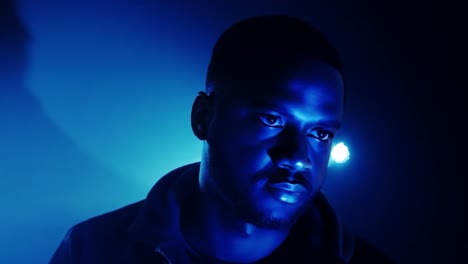 portrait of a man with blue lighting