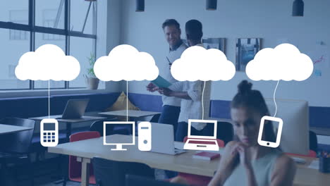 In office, diverse professionals working with cloud computing icons and animation