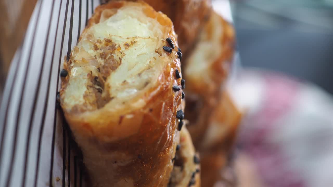 Close-up of a flaky pastry roll