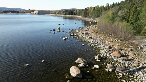 Pebbled-Shore-Of-A-Calm-Beach-In-Sweden-During-Autumn-Season