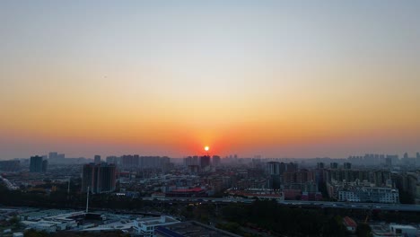 wide aerial shot of guangzhou city cityscape and skyline at sunset in guangdong, china