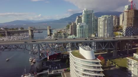 aerial shot following - tracking cars on the bridge in vancouver, bc, canada