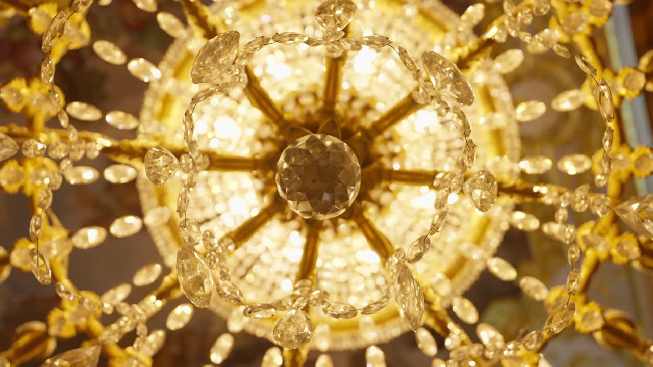 SLOW MOTION SPINING SHOT OF A CHANDELIER AT MADRID ROYAL PALACE