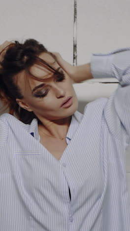portrait of a young beautiful brunette with a beautiful make up vertical video