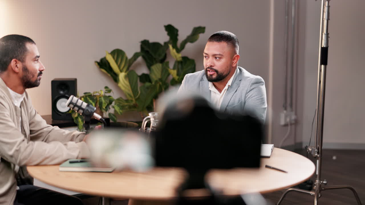 Two men recording a podcast