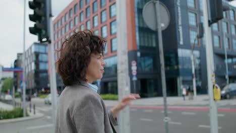 businesswoman crossing the street in the city