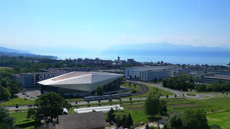 drone footage over lausanne, switzerland, swisstech convention center is center stage