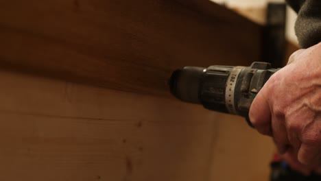 traditional boat building, pre drilling sheer strake plank, close up view