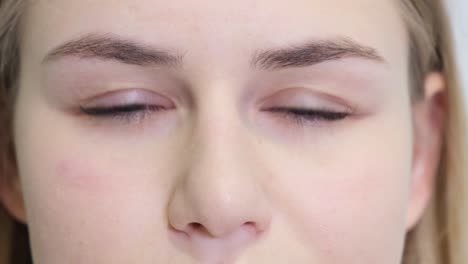 portrait of a model girl who opens her eyes wide and looks at the camera portrait of a model girl who opens her eyes wide and looks at the camera people style concept close up