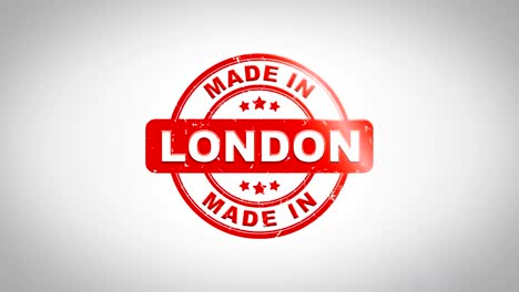 hecho en londres firmado estampado texto estampado animación de sello de madera. tinta roja en papel blanco limpio fondo de superficie con fondo matte verde incluido.