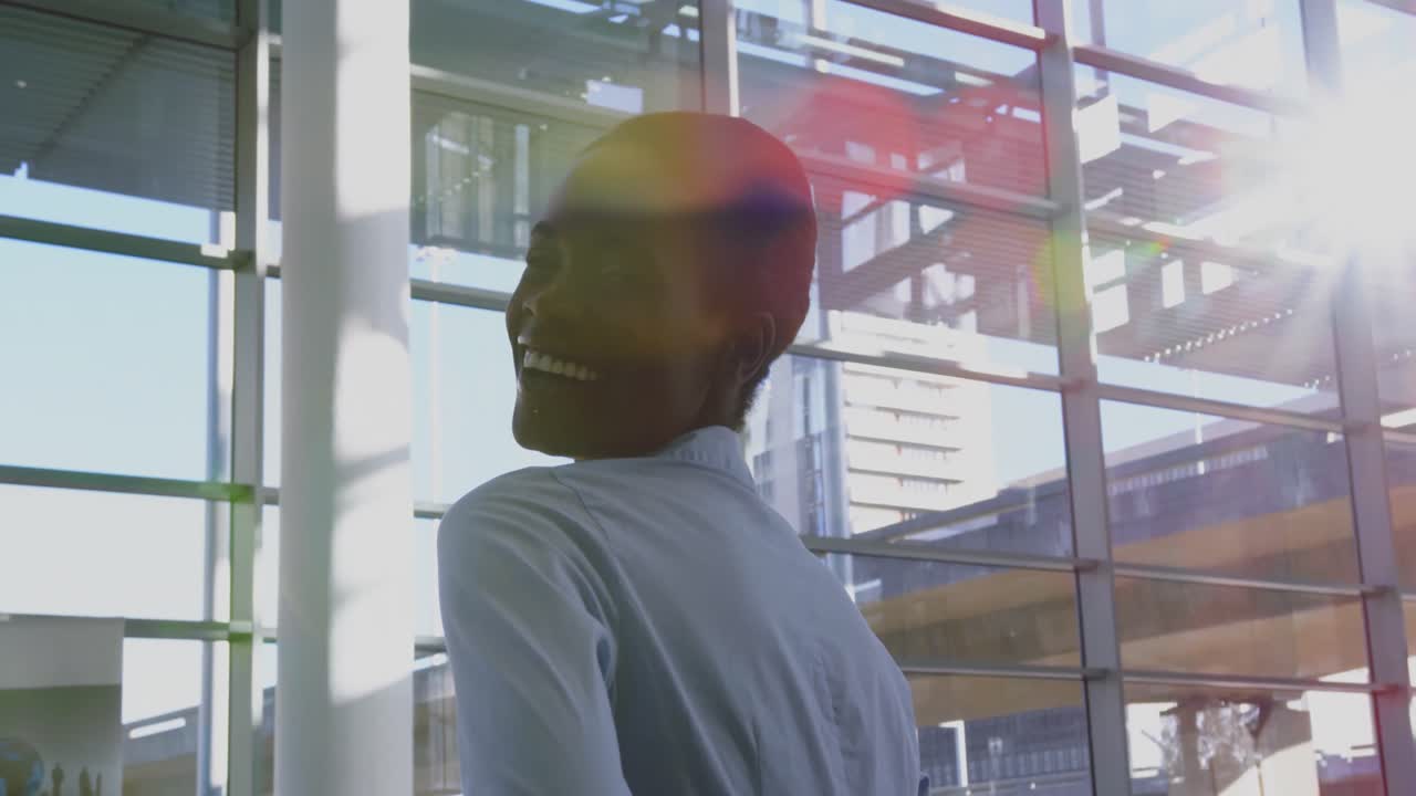 Businesswoman looking at camera in a modern office 4k