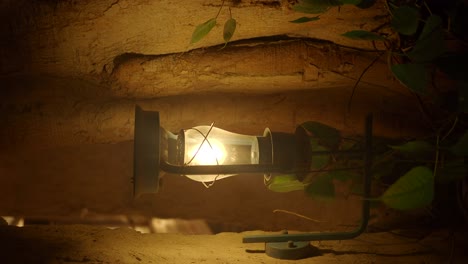 antique lantern in a cave-like setting