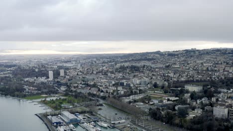 drone aerial of the beautiful swiss city center of lausanne located on the lake geneva in switzerland during winter, europe